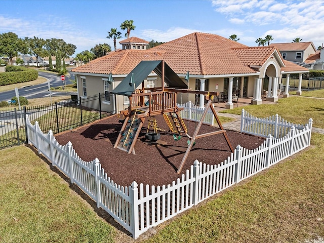 view of play area featuring a lawn