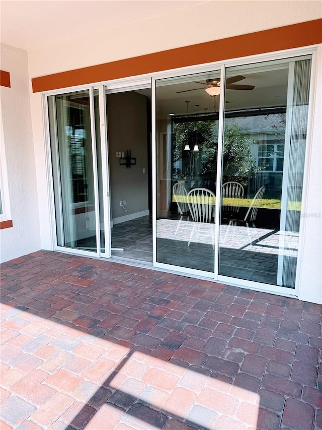 entrance to property with a patio area