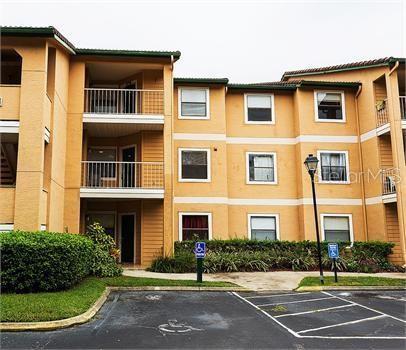 view of property featuring uncovered parking