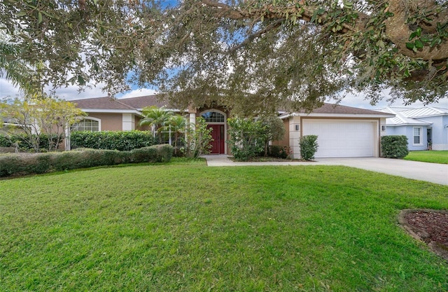 view of front of house with a front yard and a garage