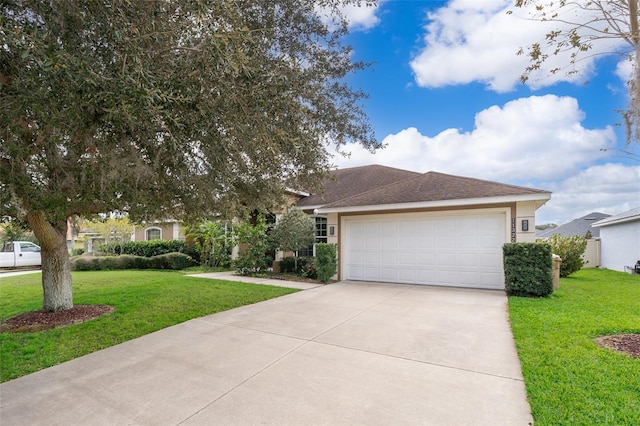 view of front of home featuring a garage and a front lawn