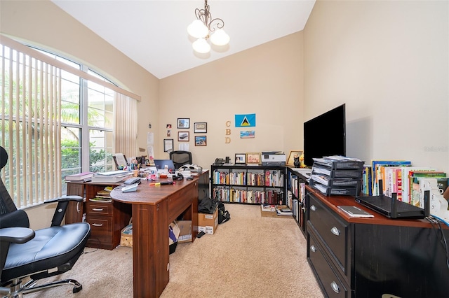 carpeted office featuring an inviting chandelier and vaulted ceiling