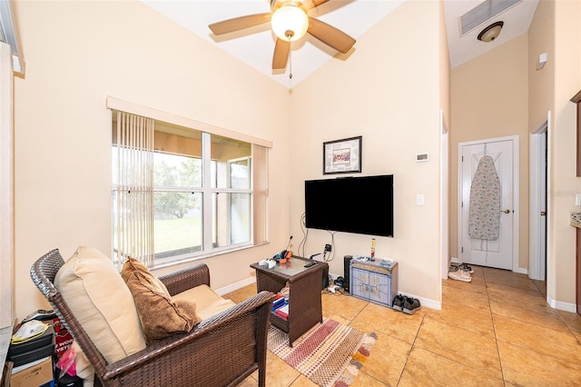 tiled living room with high vaulted ceiling