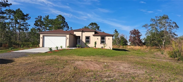 view of front facade with a front yard and a garage