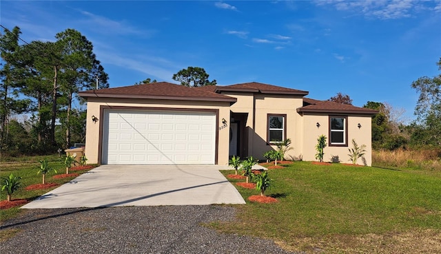 view of front facade with a garage and a front yard