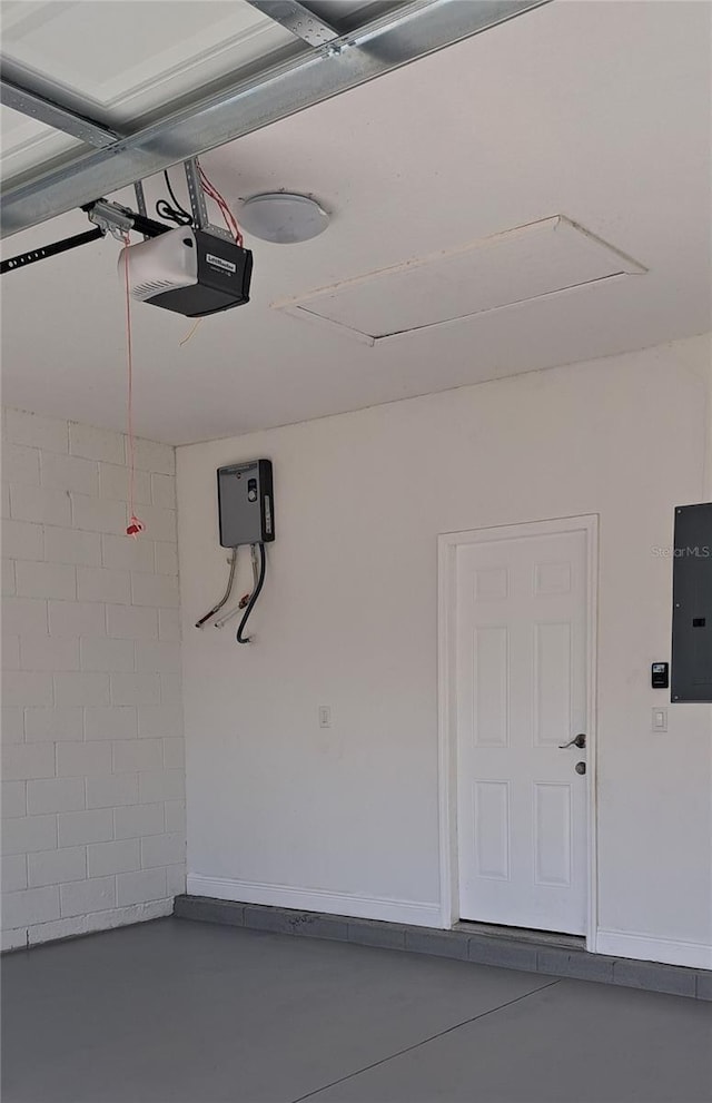 garage featuring a garage door opener and electric panel