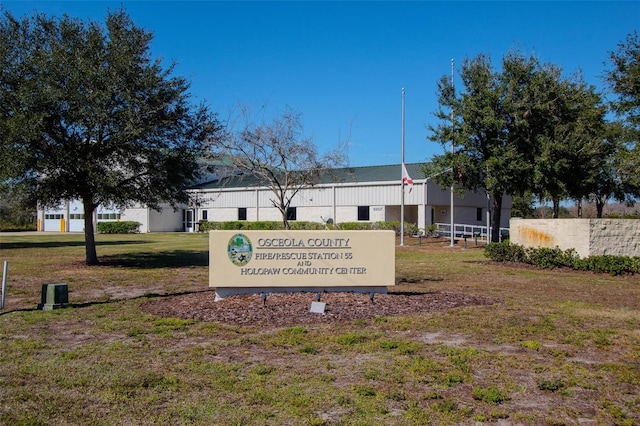 view of home's community with a yard