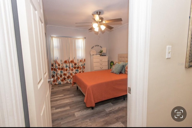 bedroom featuring wood-type flooring, ceiling fan, and crown molding