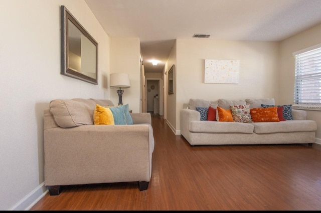 living room featuring dark wood-type flooring