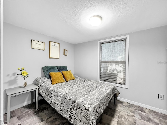 bedroom with a textured ceiling