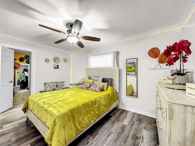 bedroom featuring crown molding, ceiling fan, and dark hardwood / wood-style flooring