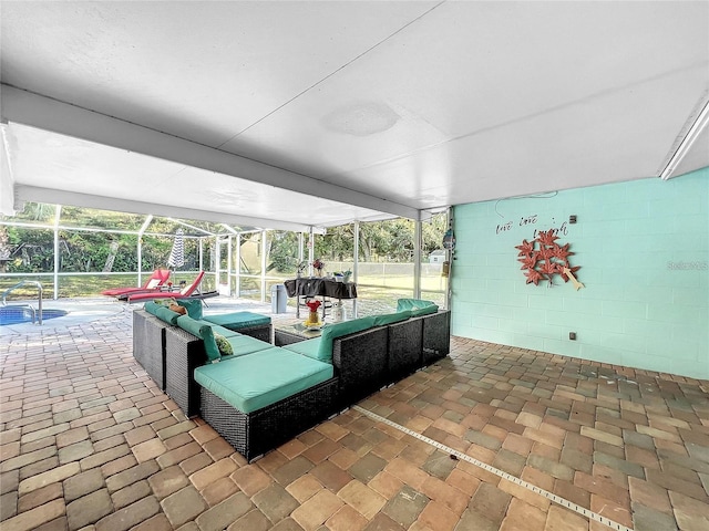 view of patio / terrace with an outdoor living space and a lanai