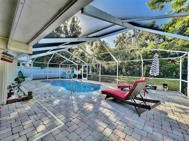 view of pool featuring a lanai and a patio area