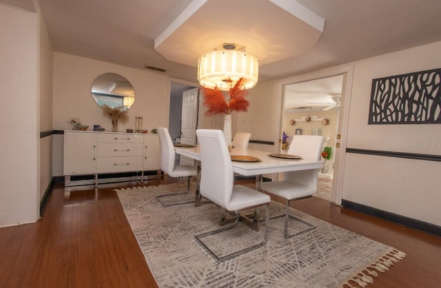 dining area with dark wood-type flooring