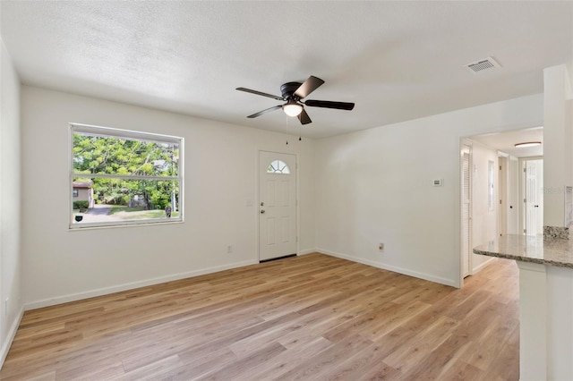 interior space featuring ceiling fan and light wood-type flooring