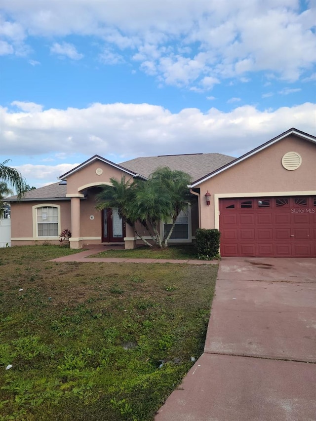 ranch-style house with a front lawn and a garage