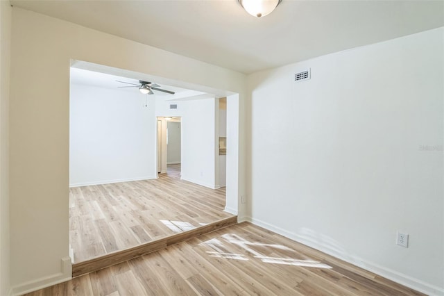 spare room featuring light hardwood / wood-style flooring