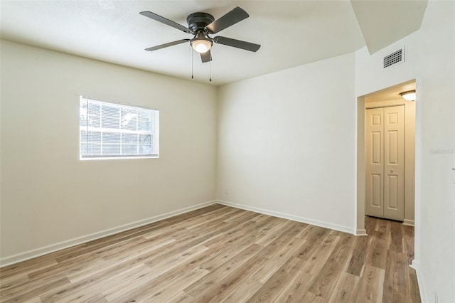 empty room with light wood-type flooring and ceiling fan