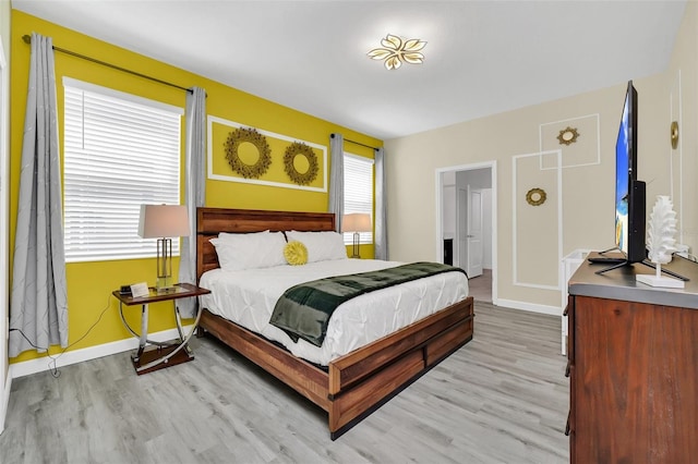 bedroom featuring light wood-type flooring