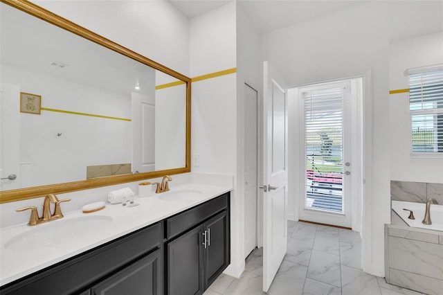 bathroom featuring a bathing tub and vanity