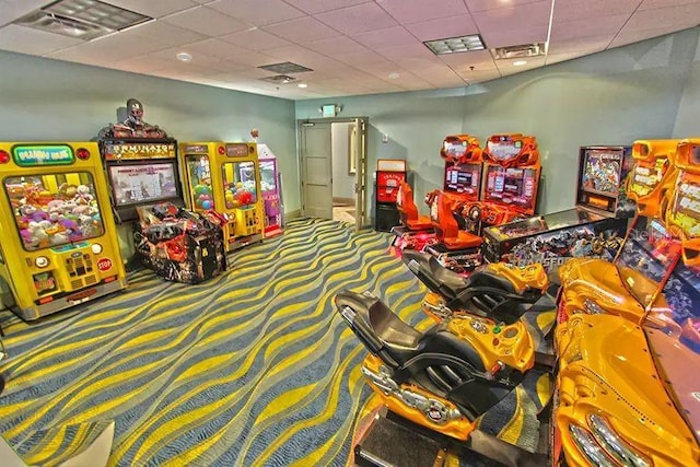 game room featuring a drop ceiling and carpet floors