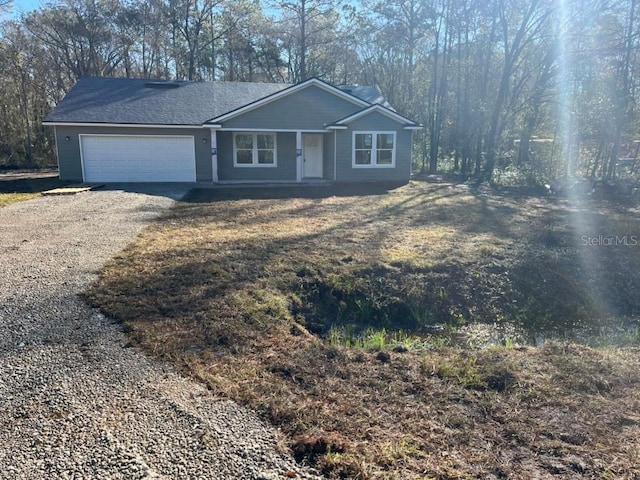 single story home featuring a garage