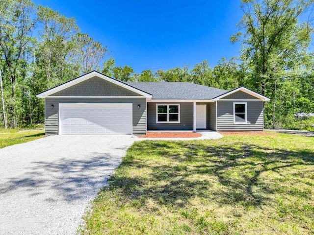 single story home with a garage and a front lawn