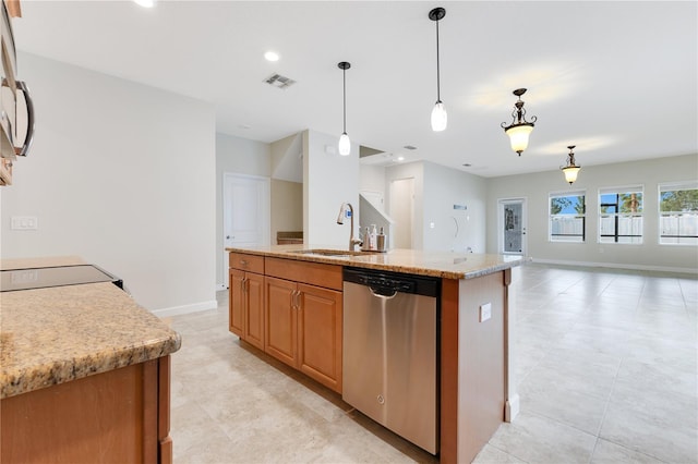 kitchen with light stone countertops, sink, stainless steel dishwasher, an island with sink, and pendant lighting