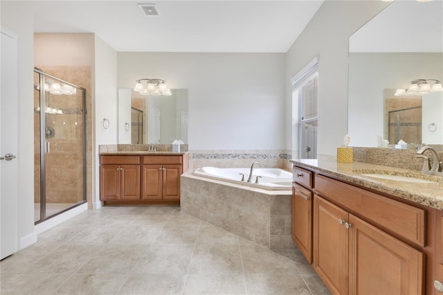 bathroom featuring tile patterned floors, vanity, and independent shower and bath