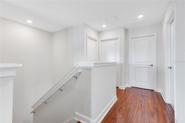 hallway with dark hardwood / wood-style floors