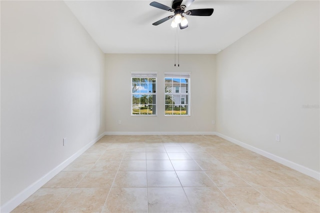 tiled empty room with ceiling fan