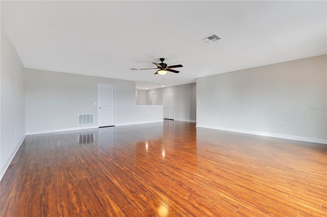 empty room featuring hardwood / wood-style flooring and ceiling fan