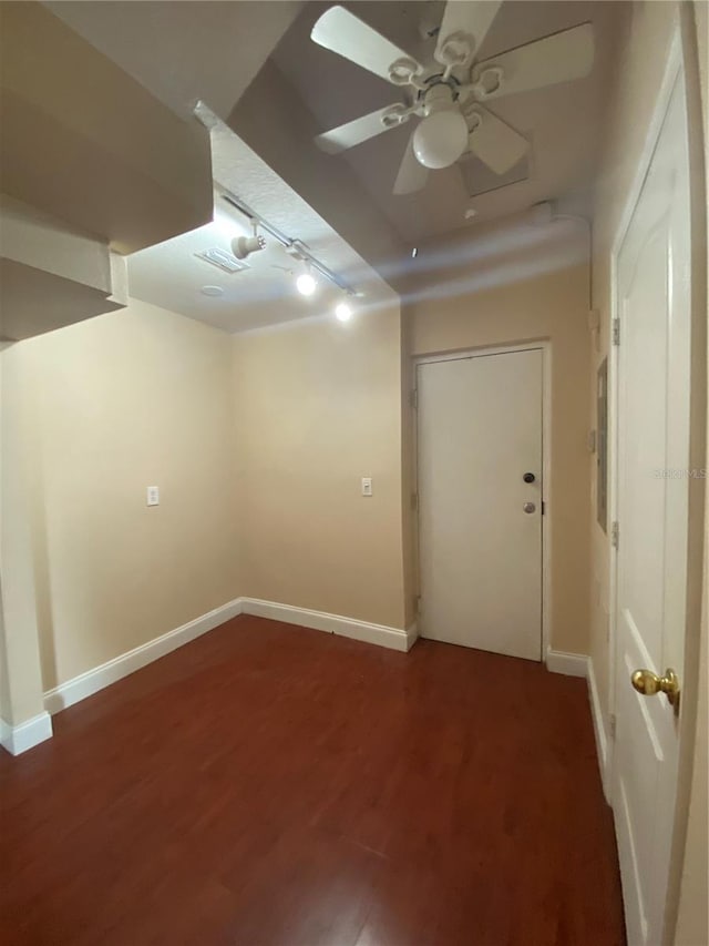 unfurnished room with ceiling fan and dark hardwood / wood-style flooring