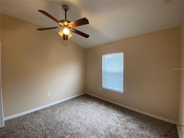 unfurnished room with carpet floors, vaulted ceiling, and ceiling fan