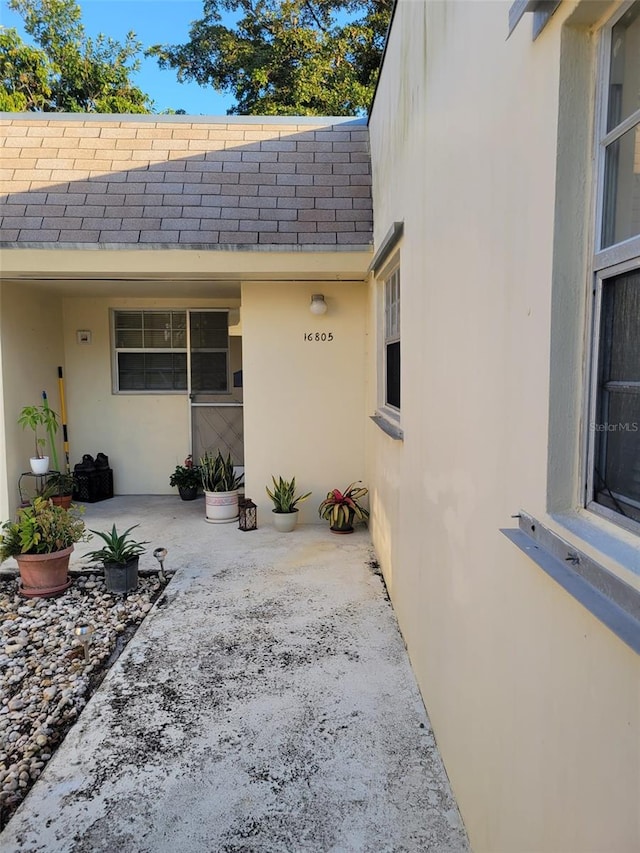 doorway to property with a patio area