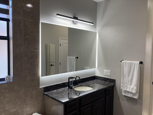 bathroom with vanity and a textured ceiling