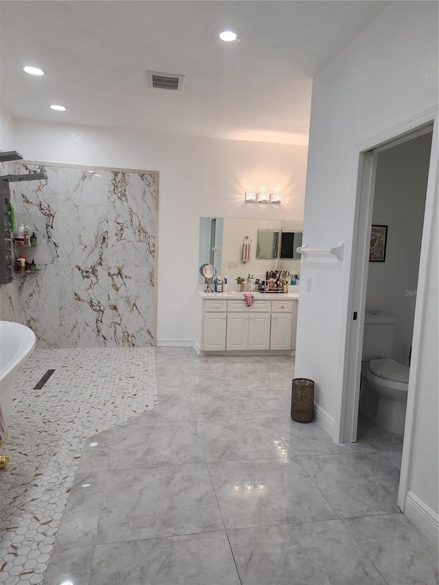 bathroom with toilet and vanity