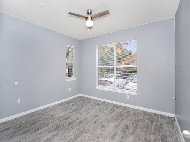 unfurnished room with hardwood / wood-style floors and ceiling fan