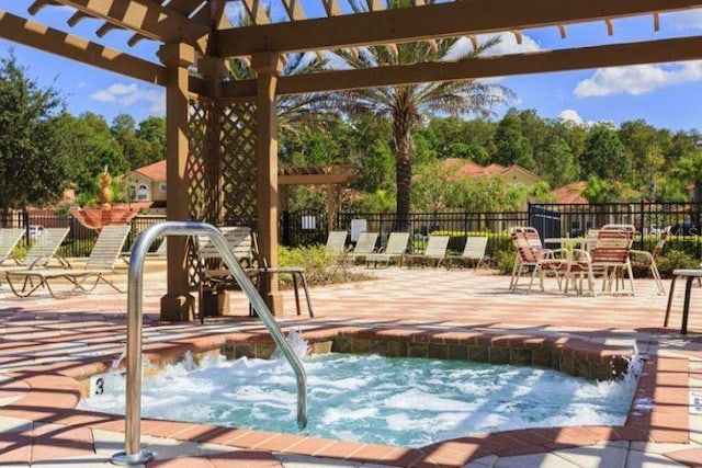 view of pool featuring a community hot tub and a patio