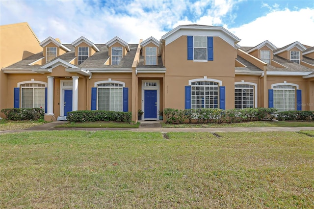 view of front of property with a front lawn