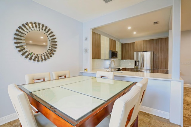 dining space featuring sink