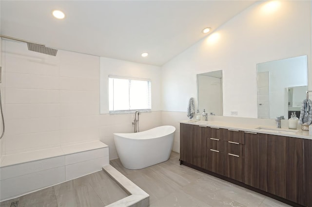 bathroom featuring vanity, lofted ceiling, and shower with separate bathtub