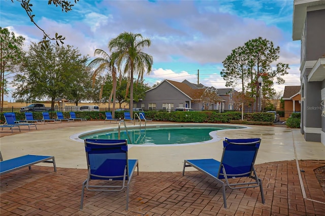 view of swimming pool with a patio area