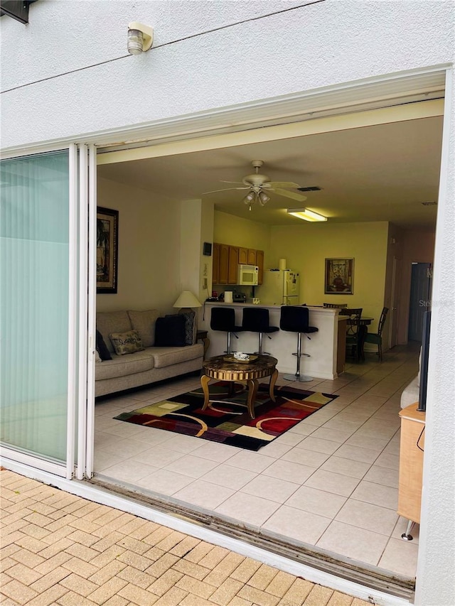 living room featuring ceiling fan