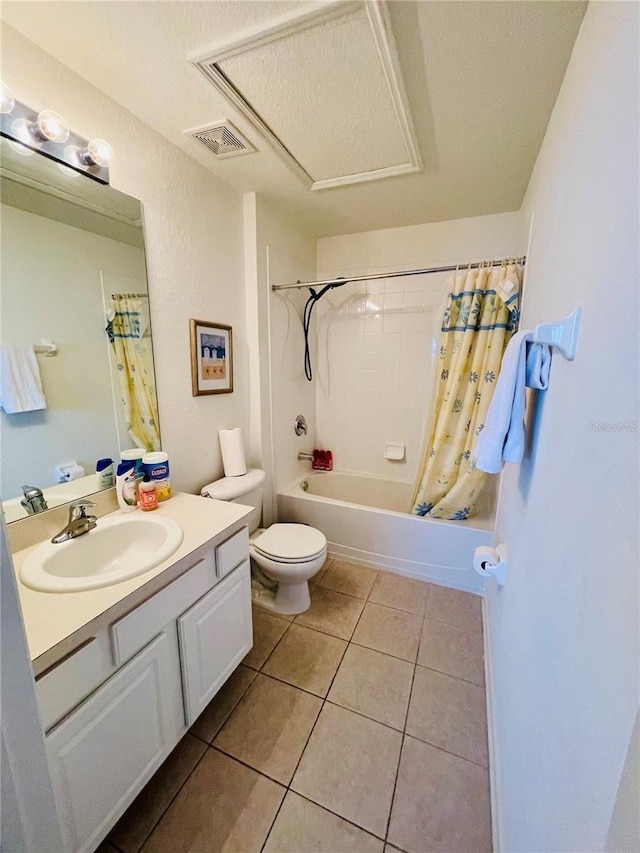 full bathroom featuring toilet, vanity, tile patterned floors, shower / bath combination with curtain, and a textured ceiling