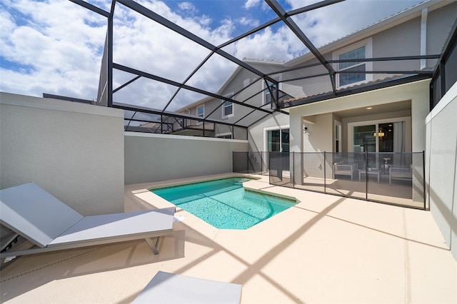 view of pool with a lanai and a patio area