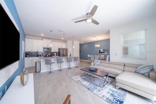 living room featuring ceiling fan