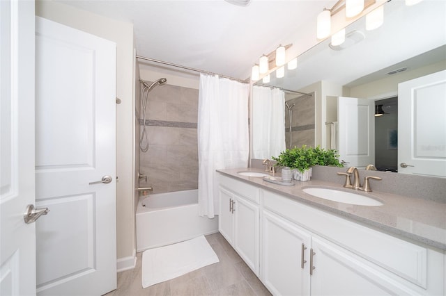 bathroom with vanity and shower / tub combo