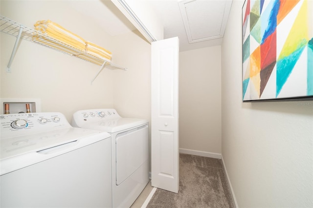 laundry area featuring washing machine and clothes dryer and light colored carpet