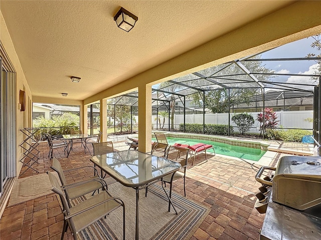 view of patio / terrace featuring a lanai and a fenced in pool